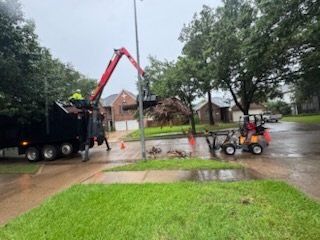 Grapple truck loading storm debris